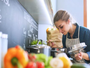 teen-cooking-healthy-dinner-pot-vegetables