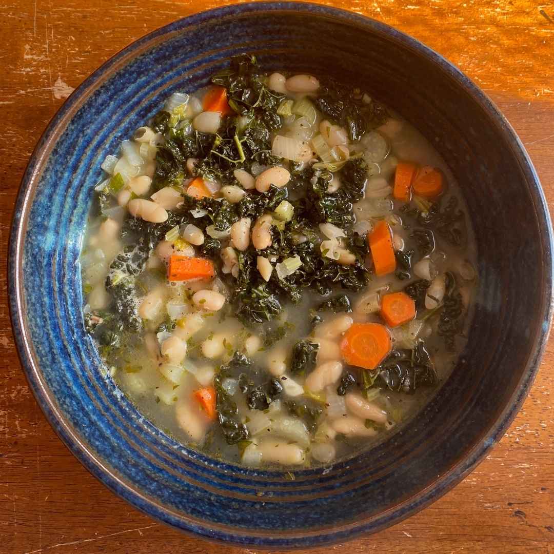 hearty bean soup with kale, carrots and celery