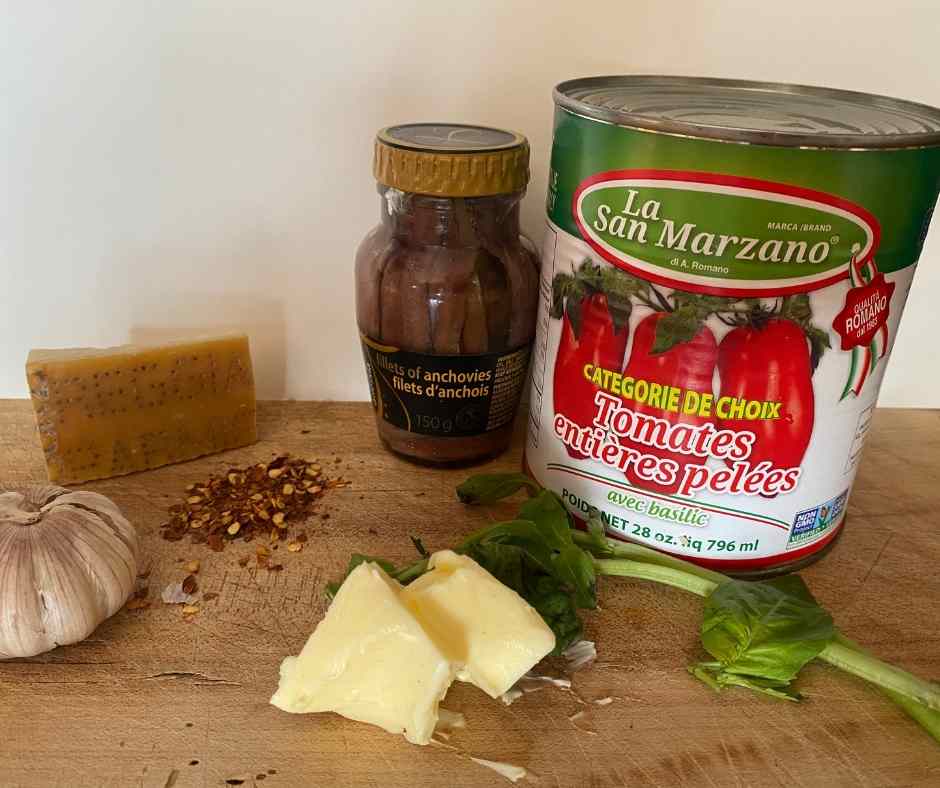 Fresh Basil, Parmesan Rind, Unsalted butter, Red Chili Flakes, Anchovies and a Can of San Marzano Tomatoes
